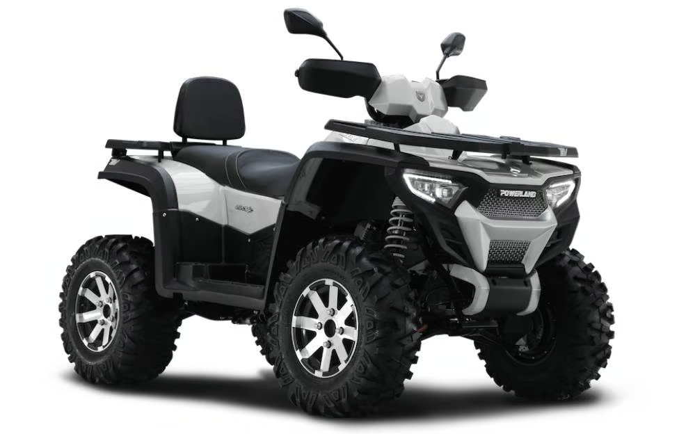 Hvid Powerland Tachyon elektrisk ATV set fra siden, med robuste hjul og et elegant design.